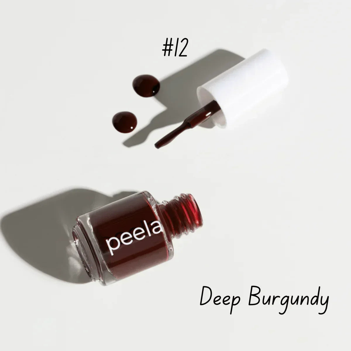 Peela #12 Deep Burgundy peelable nail polish bottle with brush and swatches, safe remover-free formula