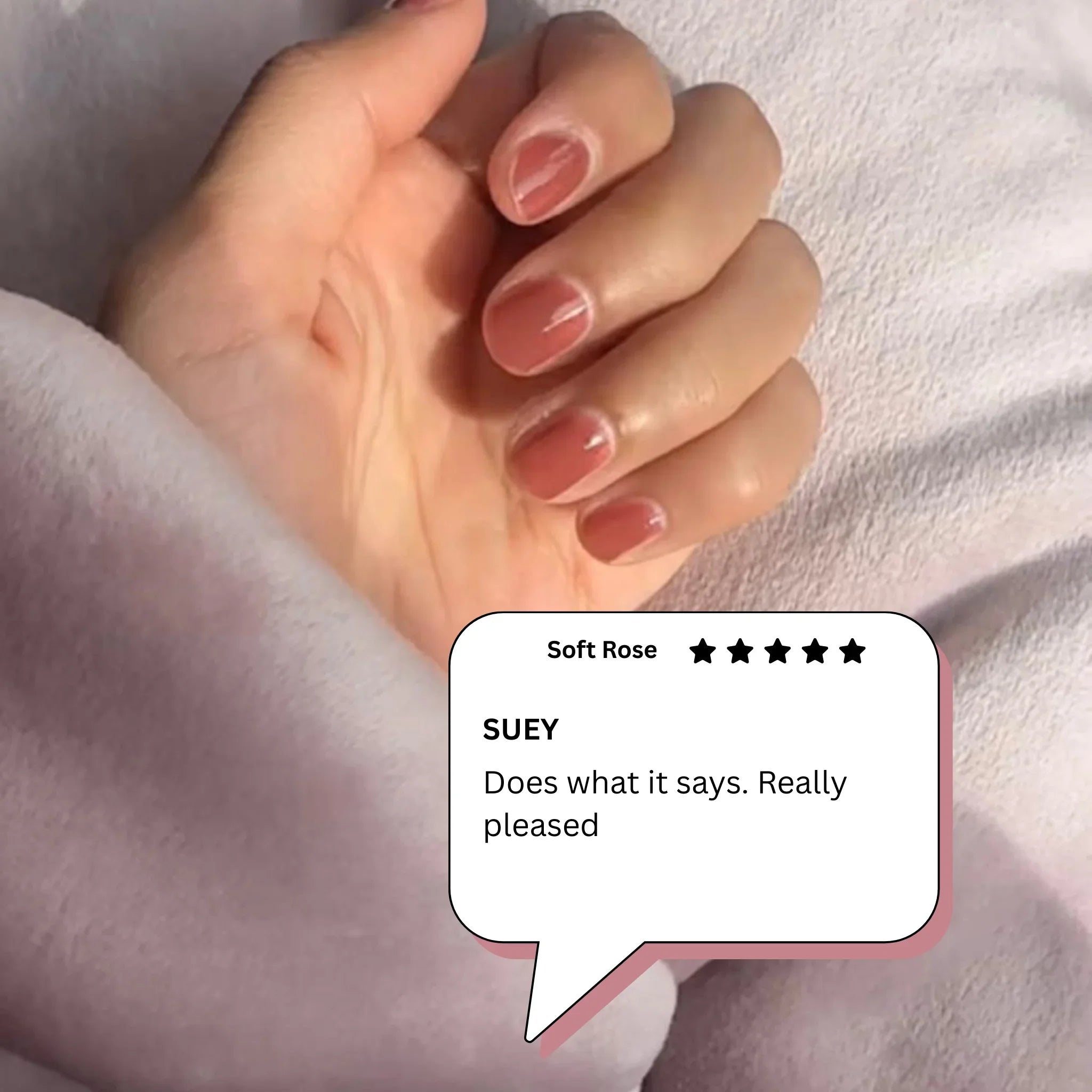 Hand with Soft Rose peelable nail polish from peelanails, five-star customer review visible