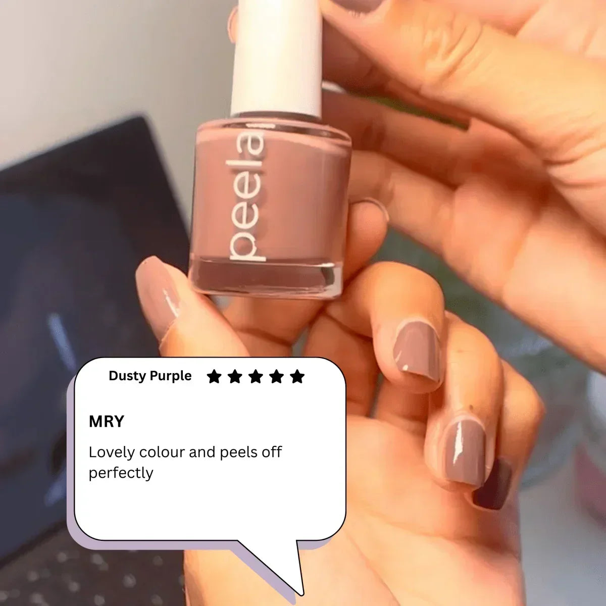 Hand holding peelanails peelable nail polish in dusty purple with matching polished nails and customer review.