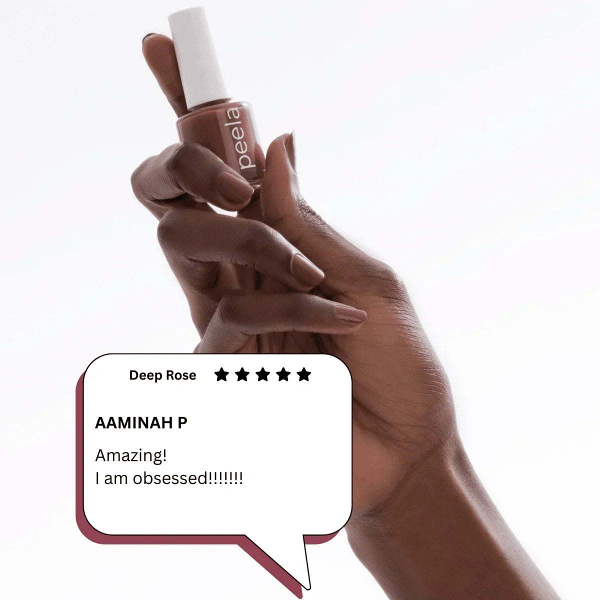 Hand holding Peela peelable nail polish bottle in Deep Rose with customer review overlay