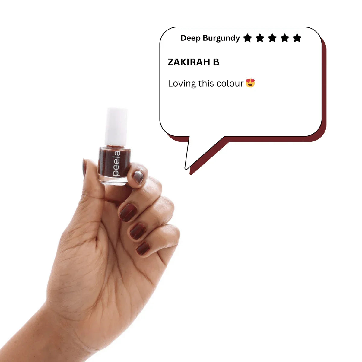 Hand holding peela Deep Burgundy peelable nail polish with matching painted nails and review